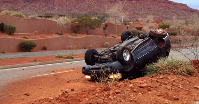 Car Flipped Over Median, Woman Unscathed